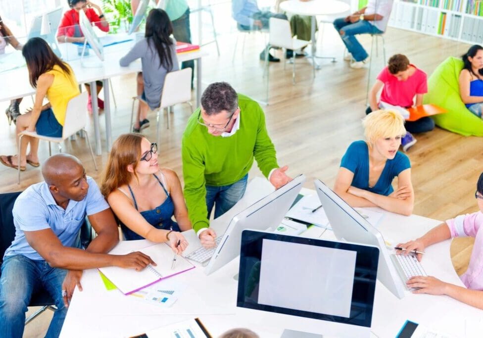 A group of people sitting around a table.